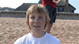 Louis on Slapton Sands at Torcross, 19.2 miles into the ride, explaining how he is "out of energy"